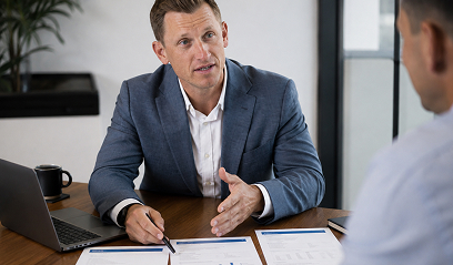 Two people reviewing options across a desk