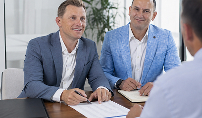 Three colleagues agreeing around a table